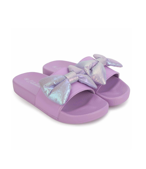Girl slides with bow